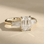 Emerald moissanite bridal ring with baguette accents