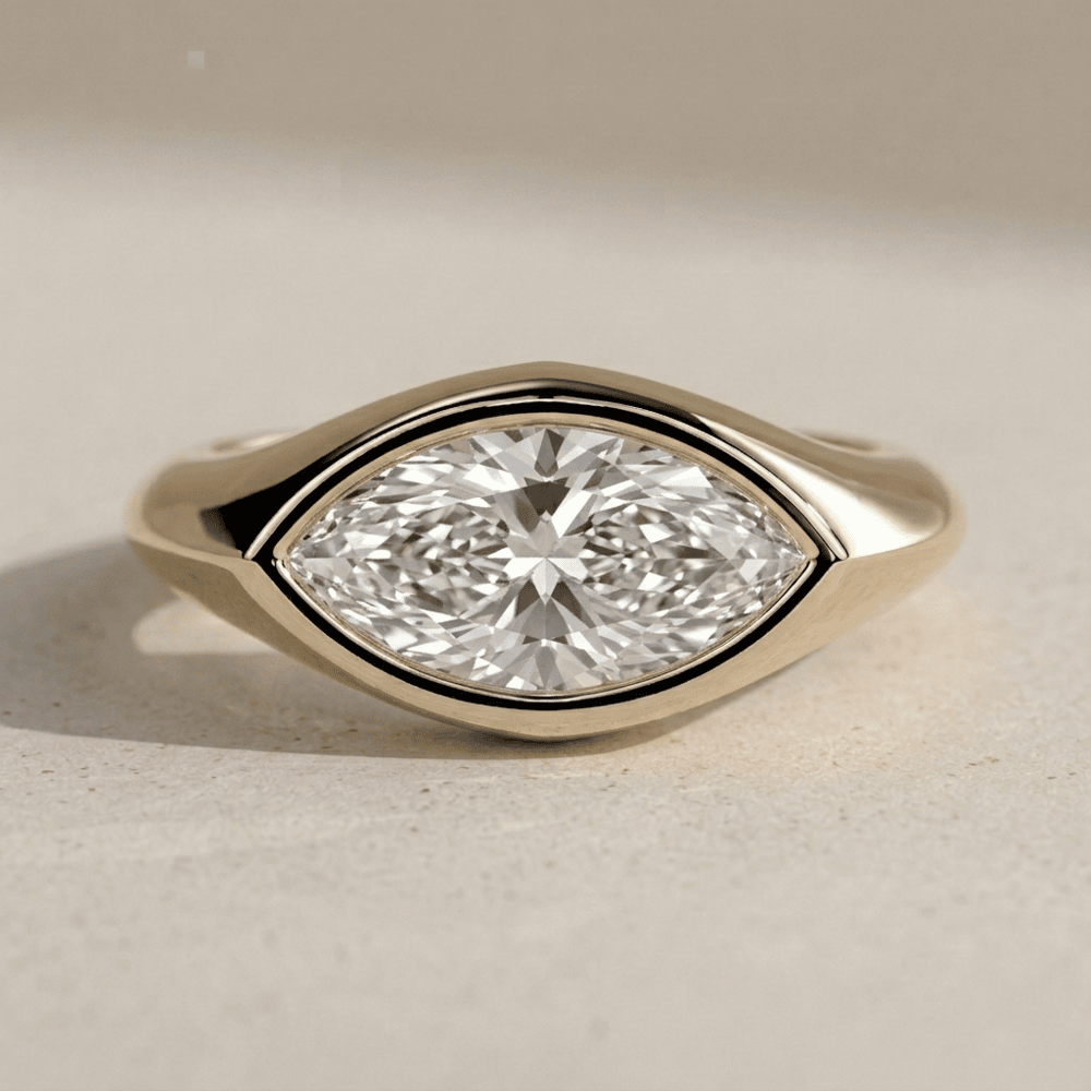 Marquise bezel set moissanite gold ring