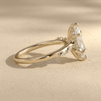 Side view of 14K yellow gold cathedral marquise moissanite ring