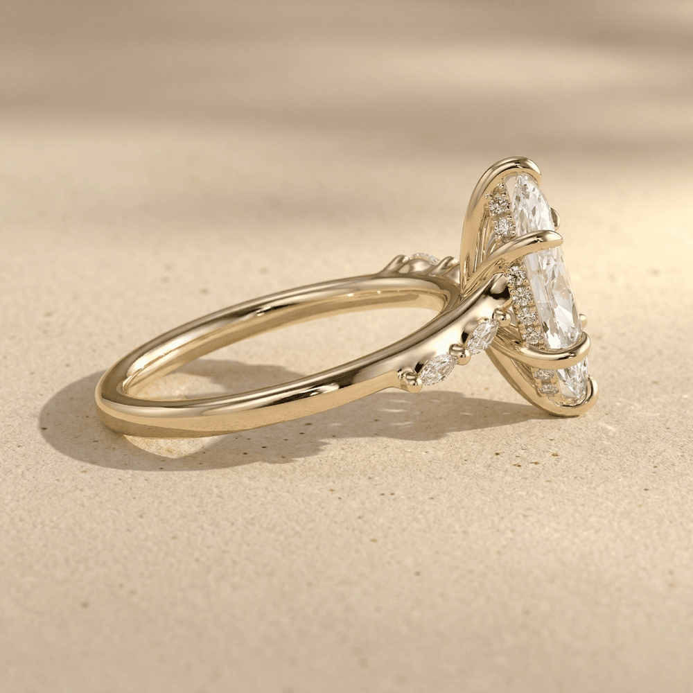 Side view of 14K yellow gold cathedral marquise moissanite ring