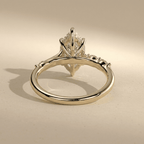 Marquise moissanite ring with yellow gold band