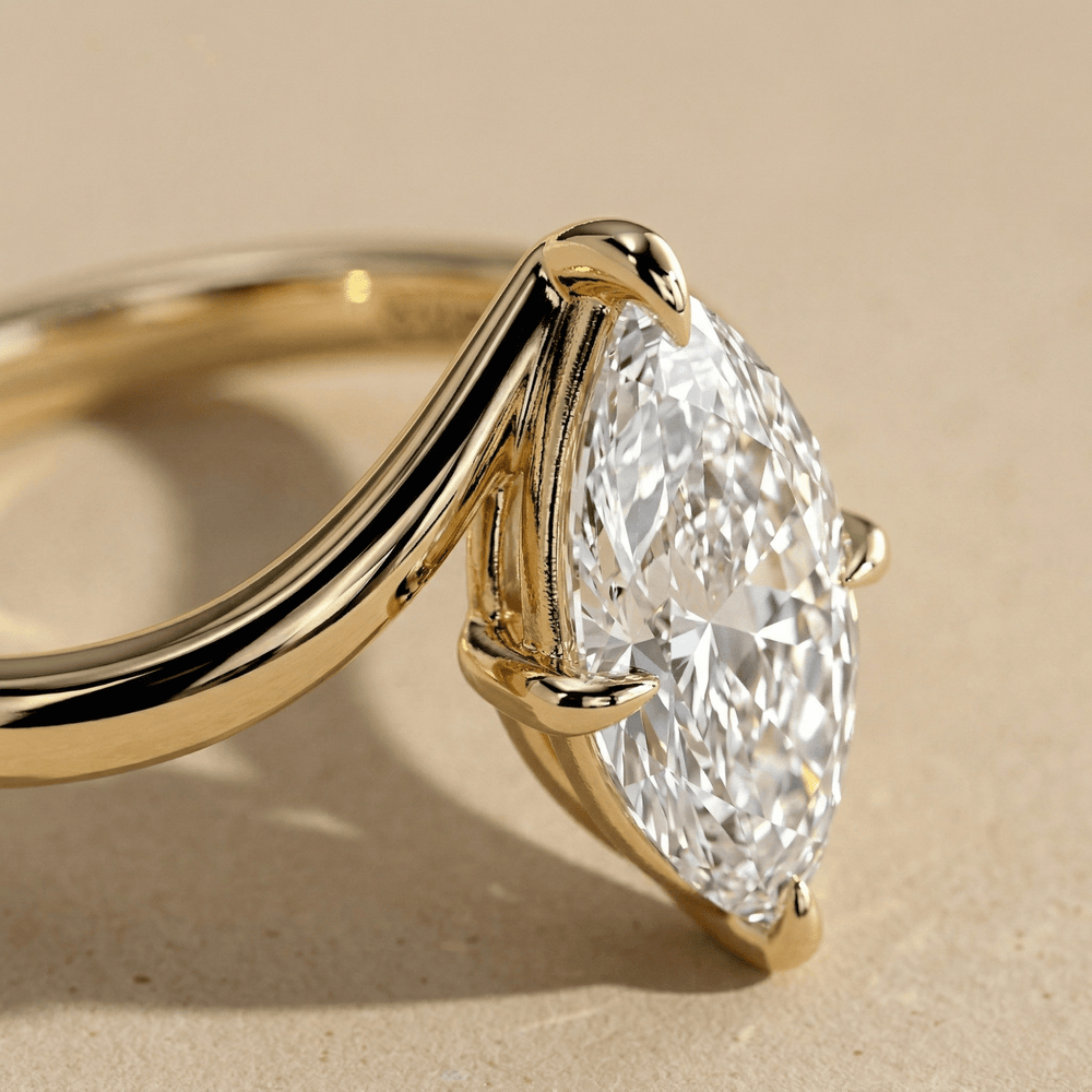 Curved bypass band marquise moissanite ring close up