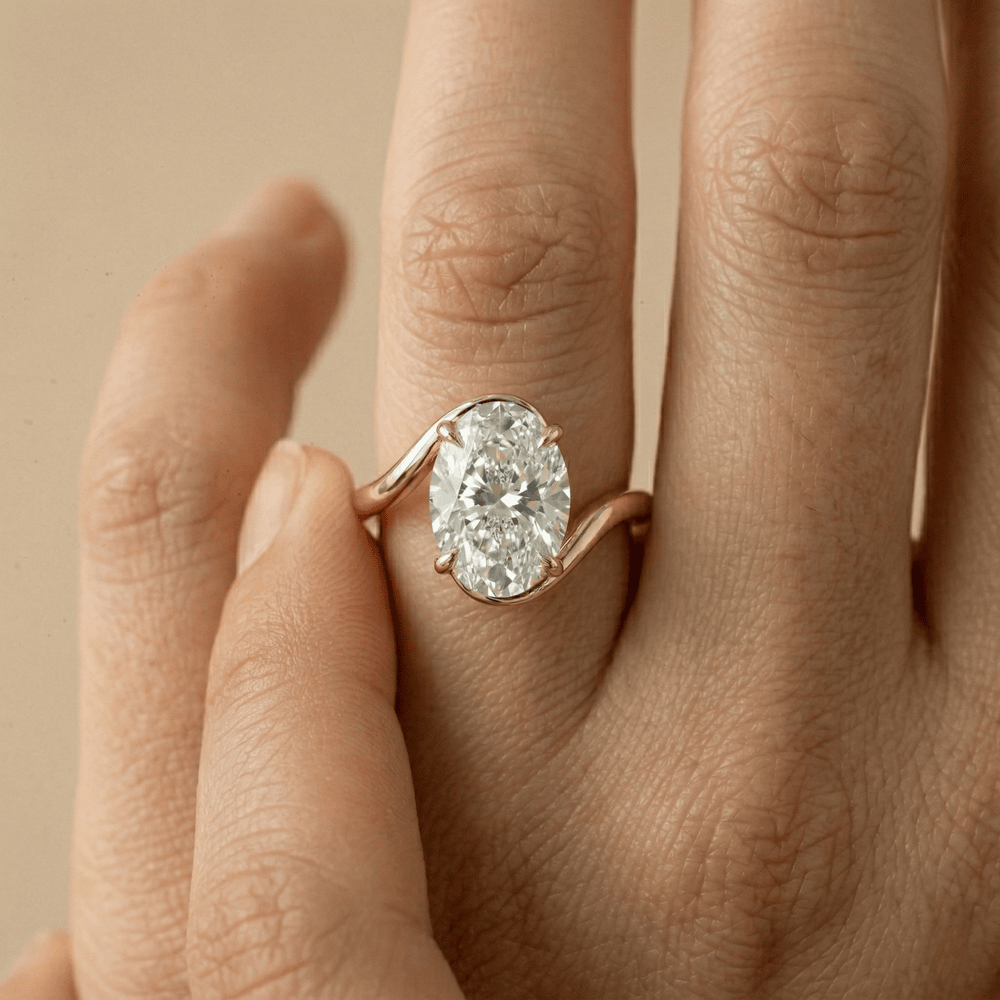 Close up of oval moissanite ring in 14K gold