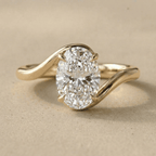 Oval cut moissanite ring in 14K gold bypass band