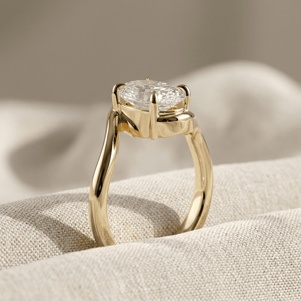 Side view of 14K gold oval moissanite engagement ring