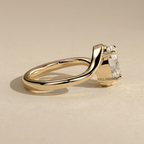 Side view of 14K gold oval moissanite engagement ring