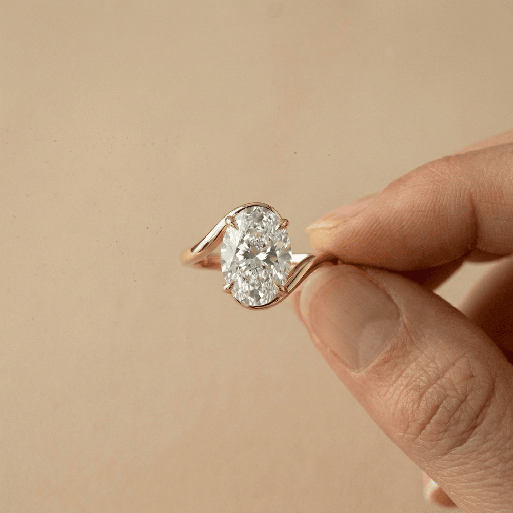 14K gold bypass style oval moissanite bridal ring