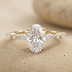 Oval moissanite engagement ring with delicate marquise band in 14K gold