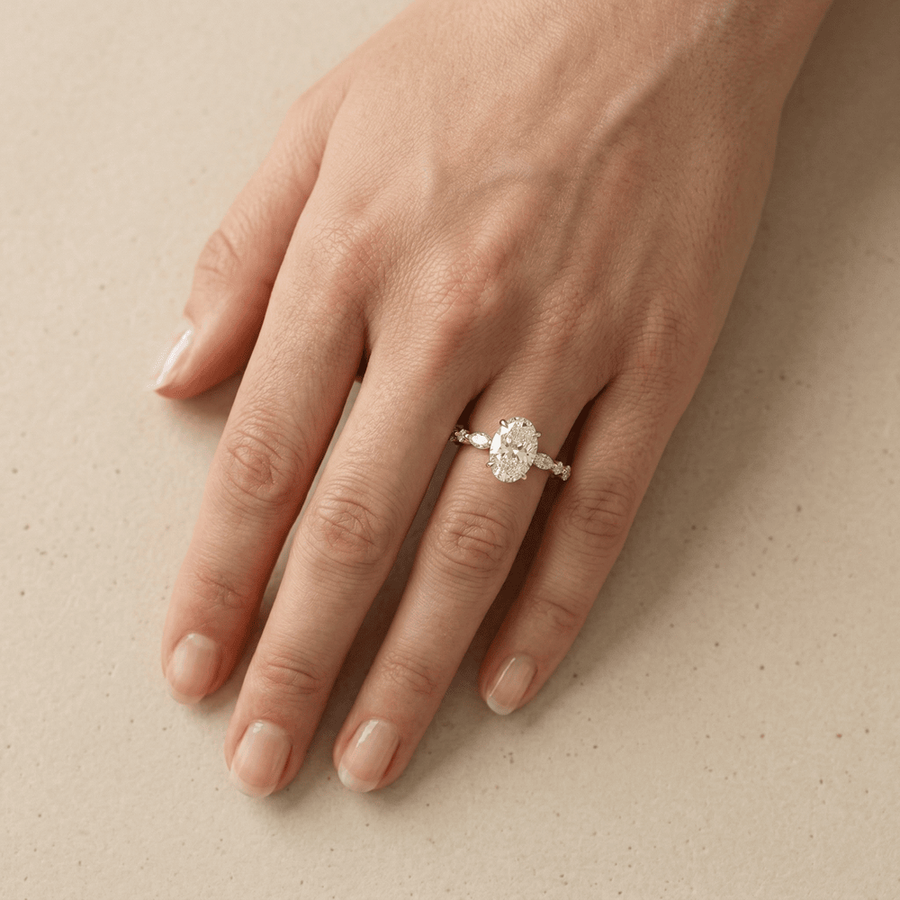Minimalist oval moissanite ring with side stones