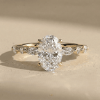 Oval solitaire moissanite ring with gold band