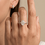 Elegant oval moissanite engagement ring with sparkling side stones