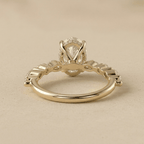 Oval moissanite engagement ring with hidden halo under setting