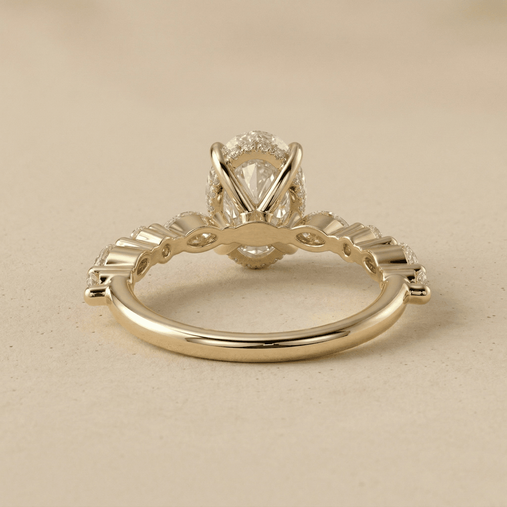 Oval moissanite engagement ring with hidden halo under setting