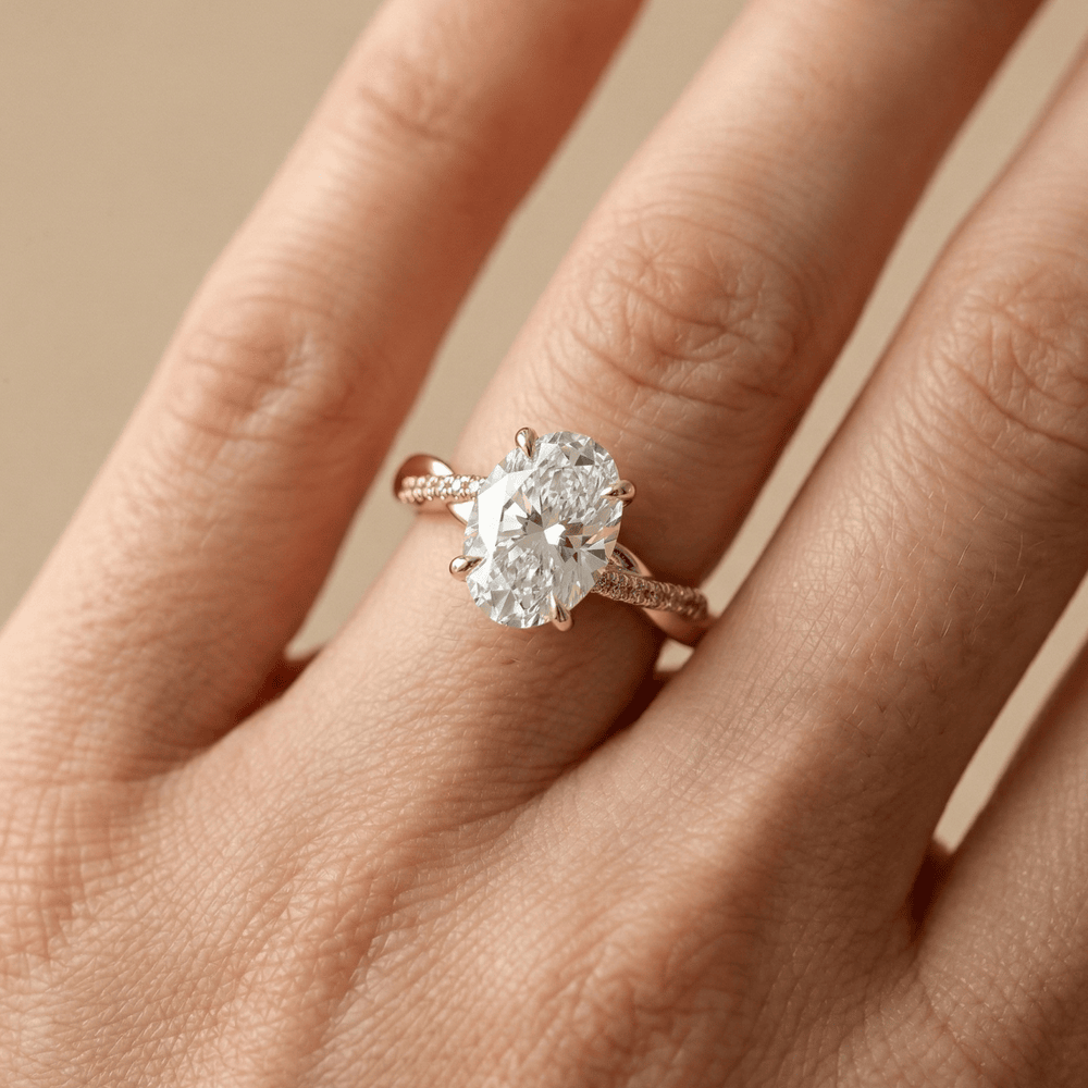 Oval moissanite bridal ring with hidden halo detail
