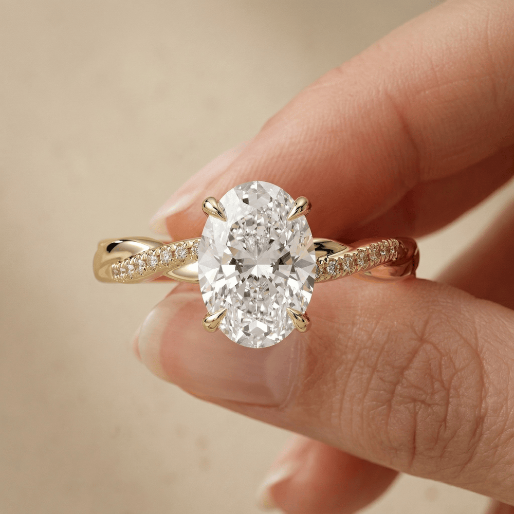 Oval solitaire engagement ring with hidden halo setting