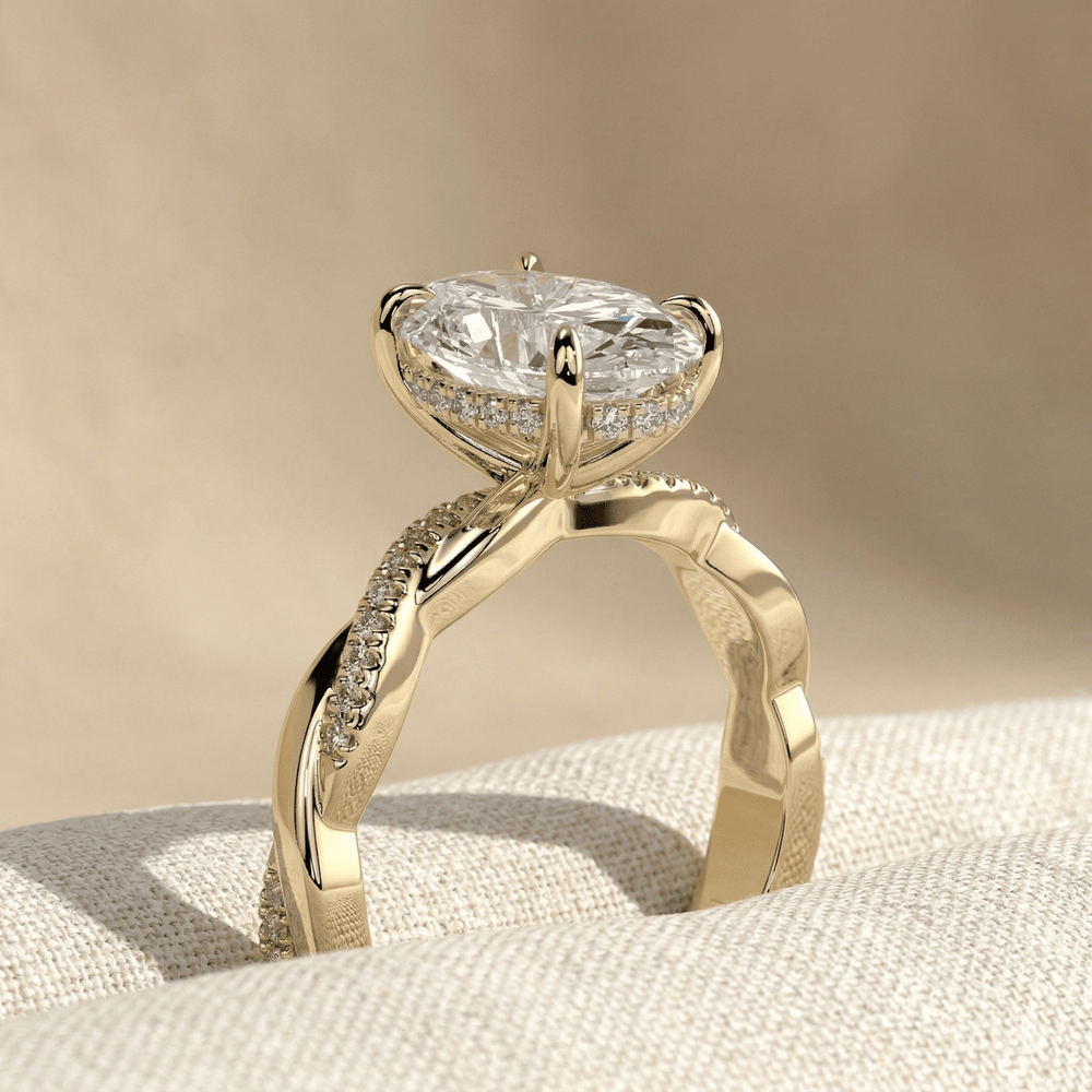 Twisted band oval solitaire moissanite ring