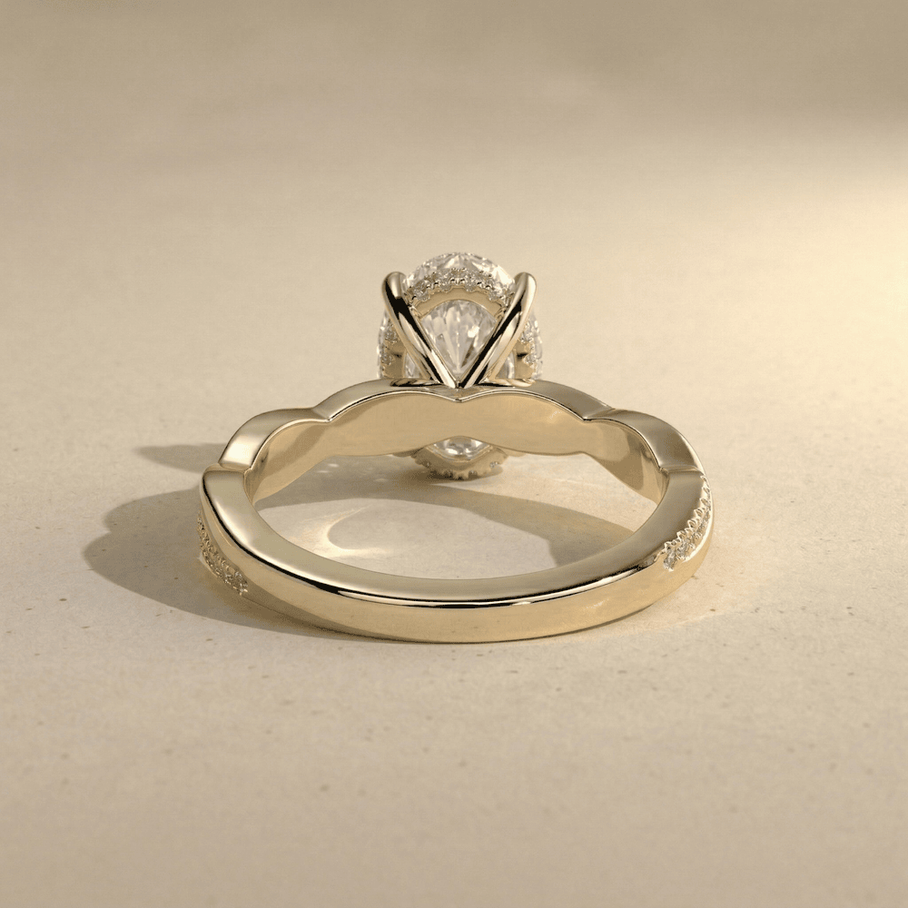 Elegant oval moissanite wedding ring with twisted band