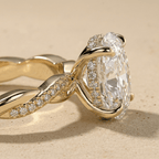 Oval cut moissanite twisted gold engagement ring