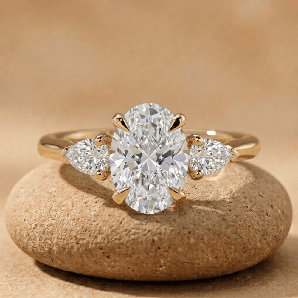 Oval moissanite three stone cathedral promise ring