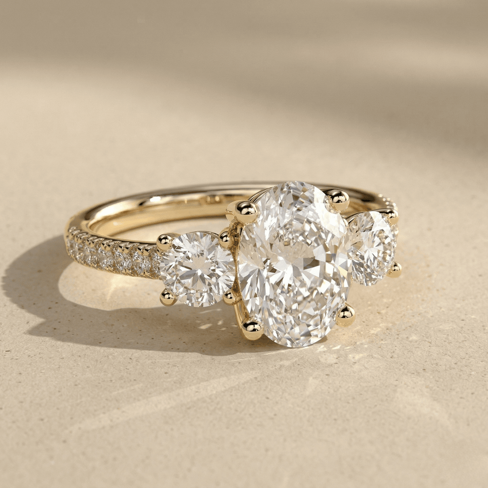 Three stone oval moissanite ring with pavé setting