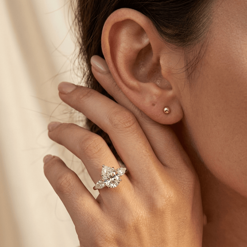 Luxury Pear Shaped Three Stone Engagement Ring