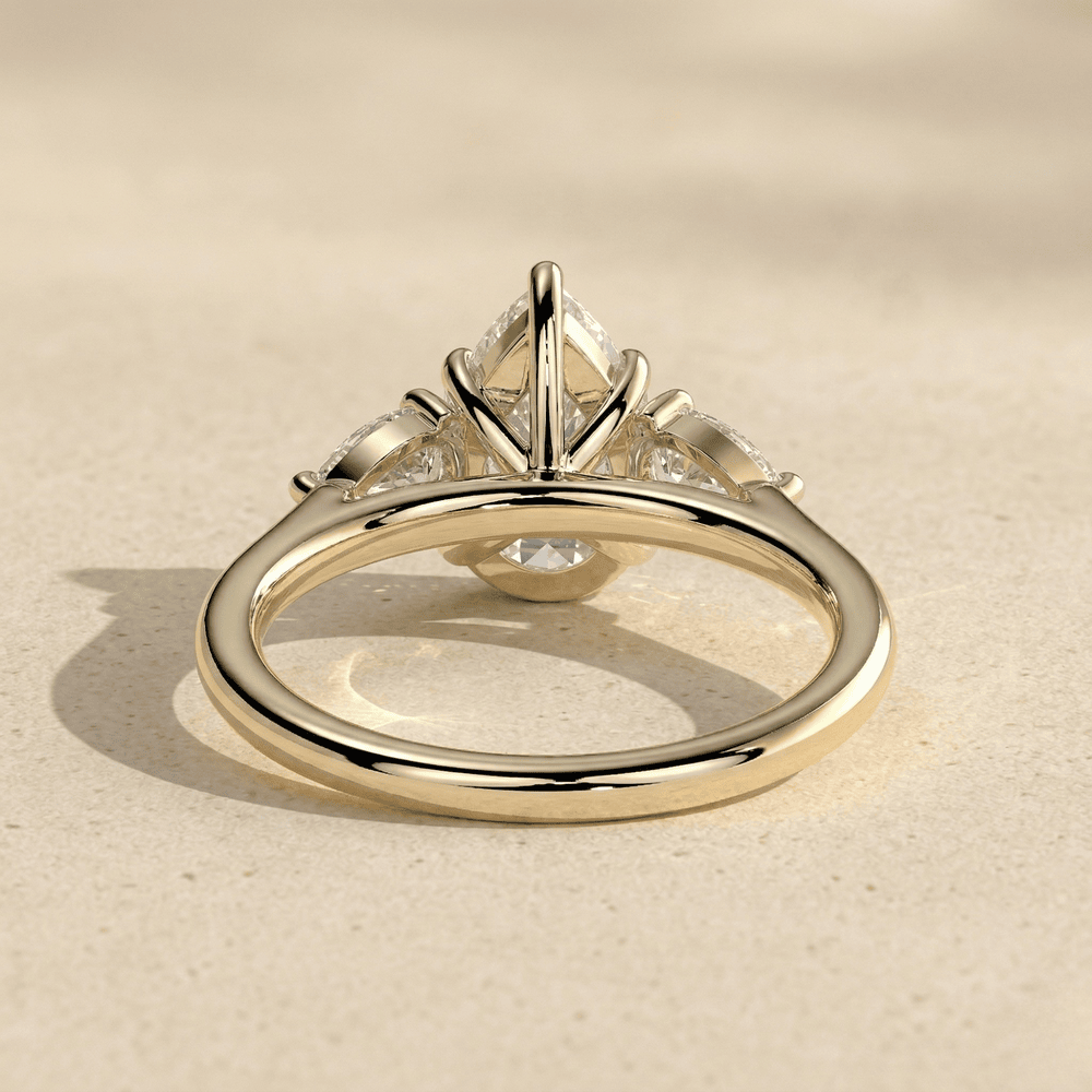Pear Cut Three Stone Gold Engagement Ring