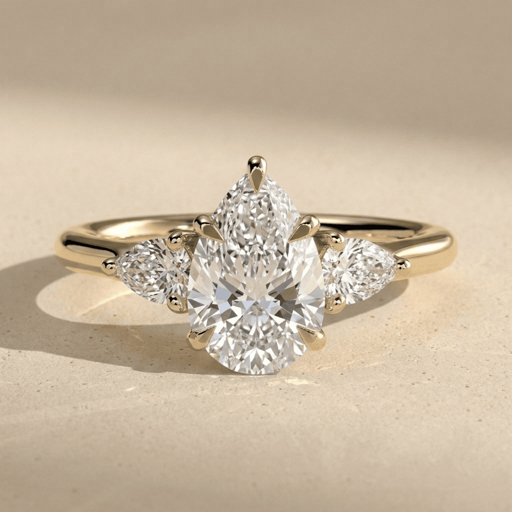 Three Stone Pear Moissanite Engagement Ring in Gold