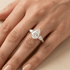 Three stone moissanite engagement ring with pavé band