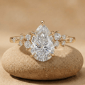 Pear moissanite cluster engagement ring in 14K gold