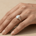 Gold pear shaped moissanite ring with detailed setting