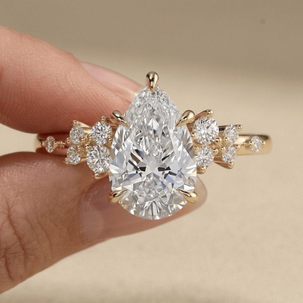 Pear shaped moissanite cluster ring for marriage proposal