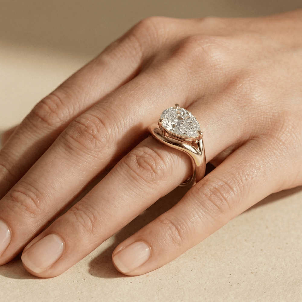 Contemporary pear cut moissanite wedding ring