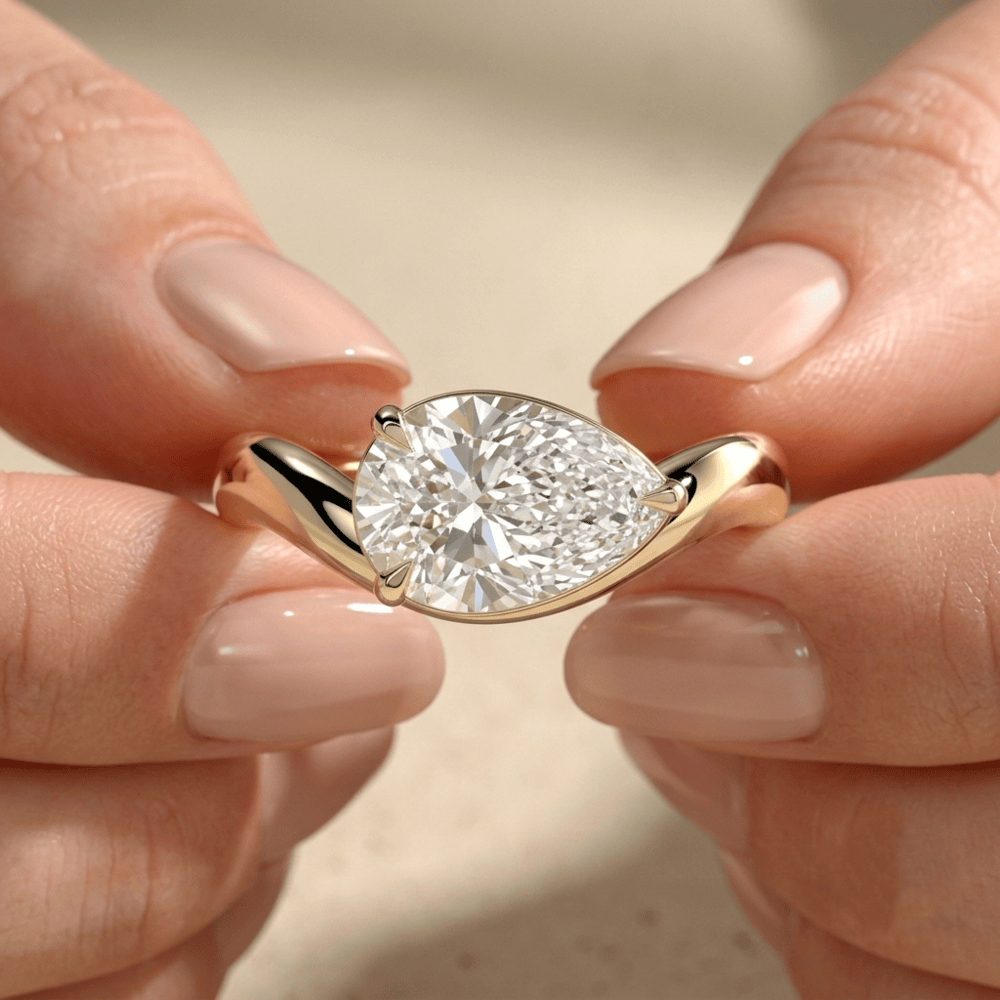 East west pear cut moissanite promise ring