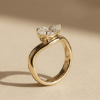 Pear solitaire promise ring with curved gold band