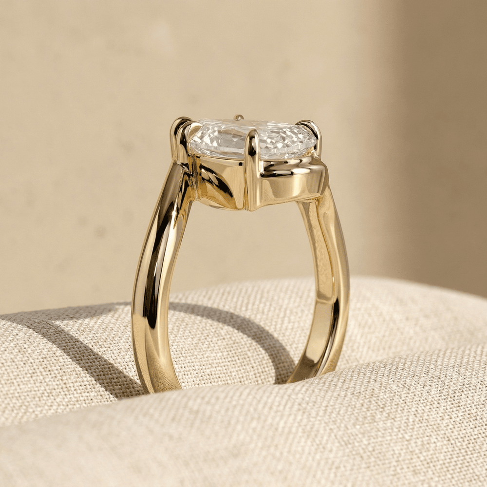 Pear moissanite bypass engagement ring in solid 18K gold