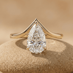 Pear solitaire moissanite curved wedding ring in 10K gold