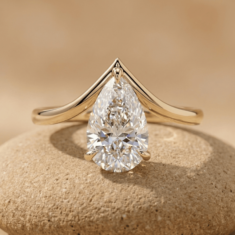 Pear solitaire moissanite curved wedding ring in 10K gold