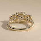 Round moissanite three stone gold engagement ring design