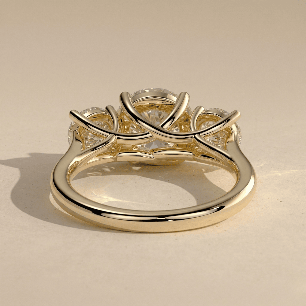 Round moissanite three stone gold engagement ring design