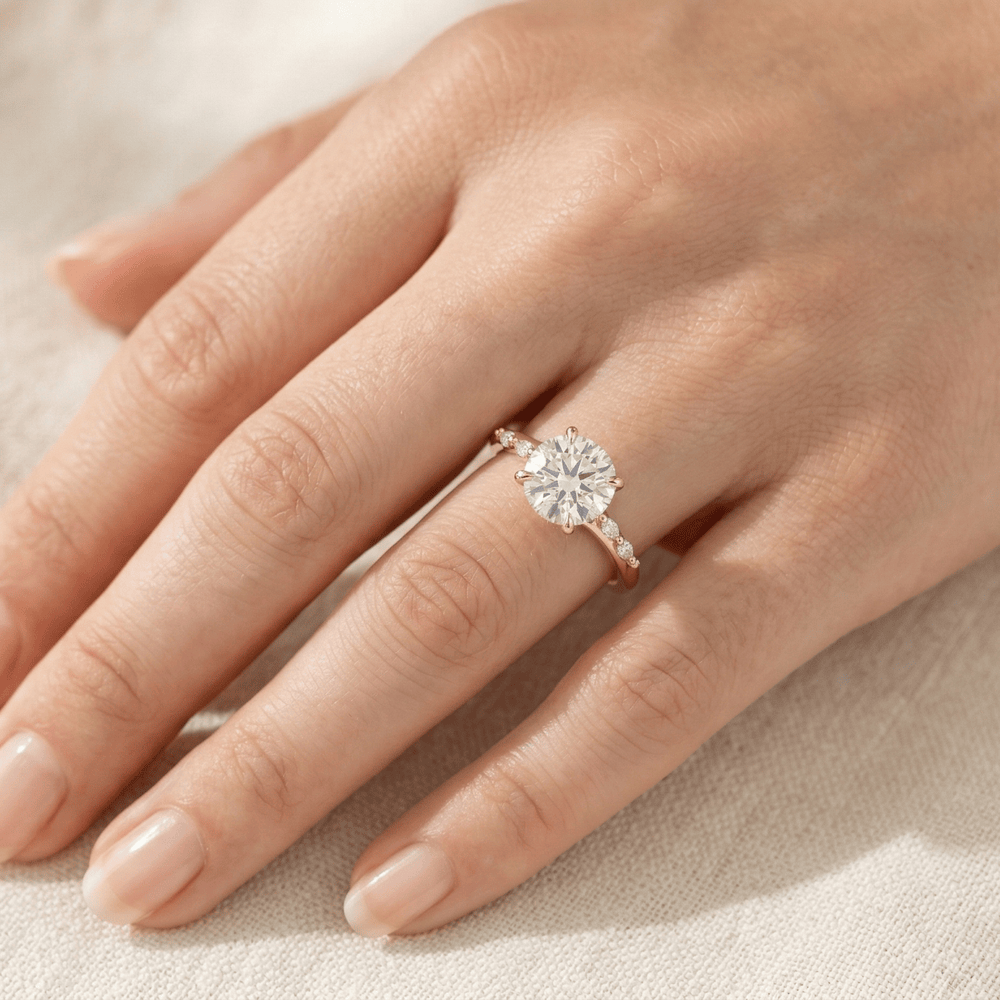 Cathedral style round moissanite proposal ring in gold