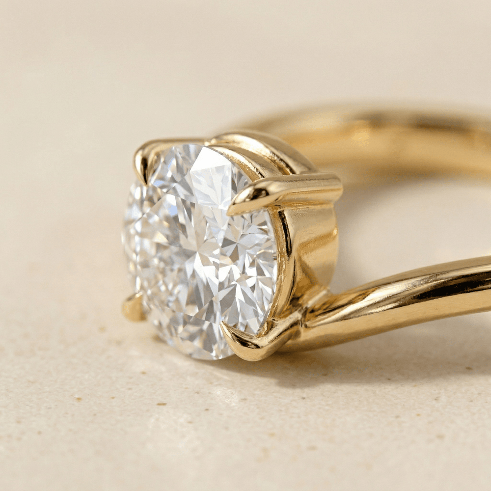Round solitaire moissanite ring with bypass band close up