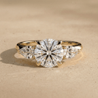 Round cut moissanite three stone gold ring