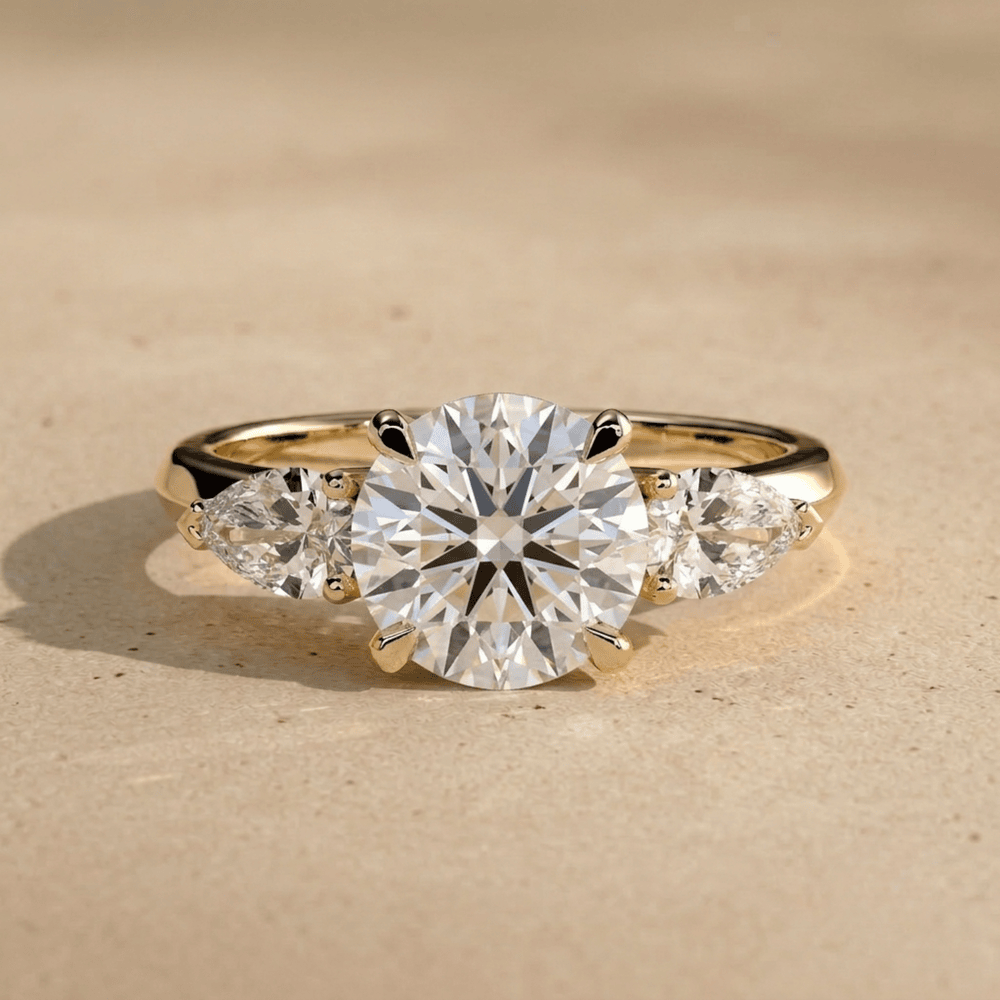 Round cut moissanite three stone gold ring