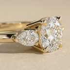Elegant three stone moissanite ring in yellow gold