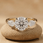 Round three stone moissanite engagement ring in 14K gold