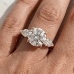 Round cut three stone moissanite bridal ring in 14K gold