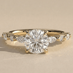 Vintage round moissanite ring with side stones in yellow gold